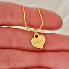 Load image into Gallery viewer, Reluxe Vintage Prada Gold Heart Necklace
